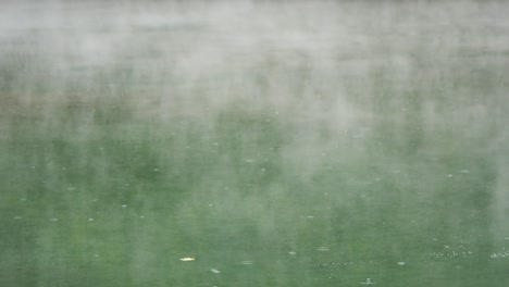 thermal valley hot spring lake smoky surface rain water ripple in beitou, taiwan taipei