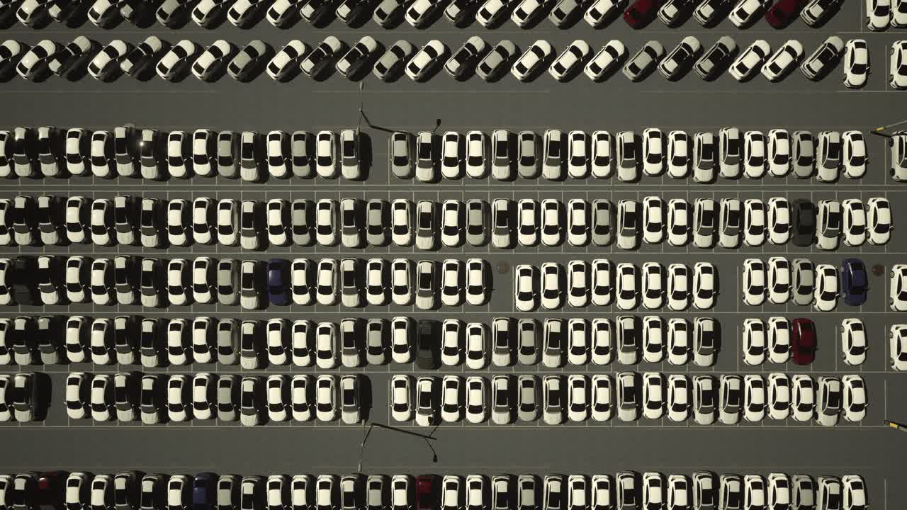 Aerial View of a Large Parking Lot Filled with Cars