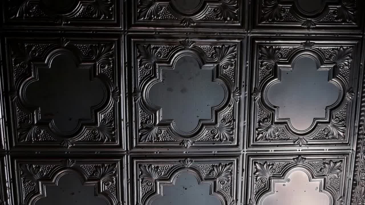 Detailed black ceiling in a trendy bar