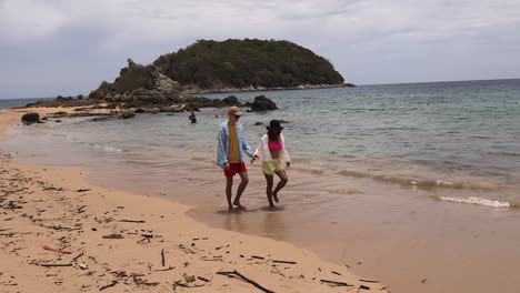 couple walking on a beautiful beach