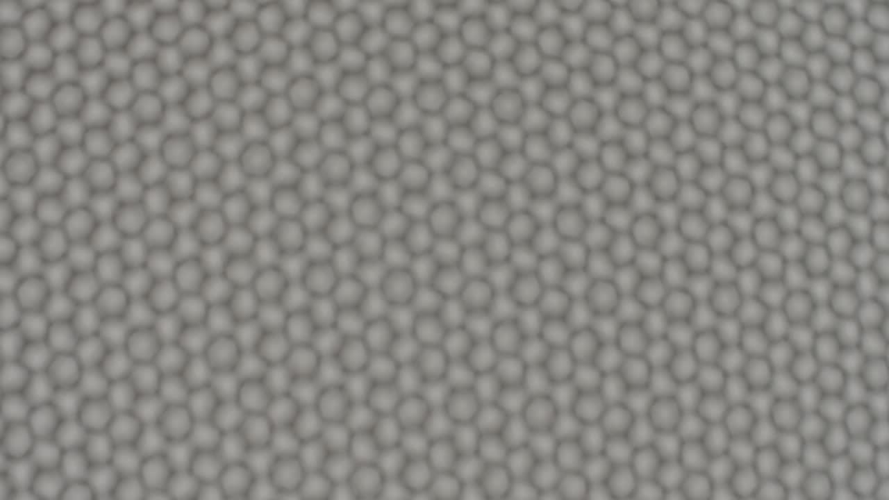 un patrón de hexágonos se mueve rítmicamente a través del marco