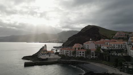 Cosy-beach-in-serene-village-Marina-da-Quinta-Grande,-Madeira,-Portugal,-aerial
