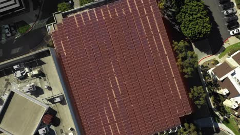 solar panel on top of parking structure, renewable energy with motion graphic, aerial birds-eye