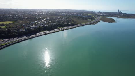 northcote point highway along shoal bay in auckland, new zealand - aerial drone shot