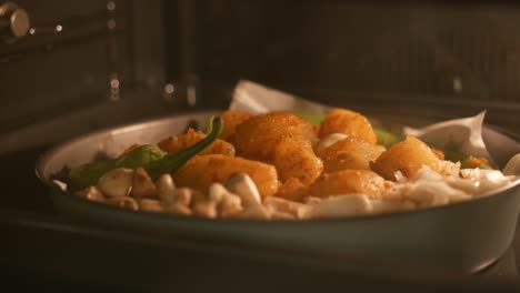 roasted potatoes, onions, and green peppers in the oven