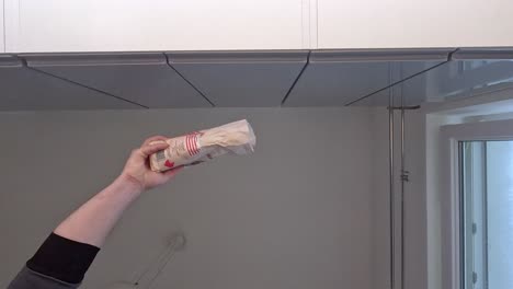 ceiling-pointed-falling-flour-on-camera-in-slow-motion-hand-visible