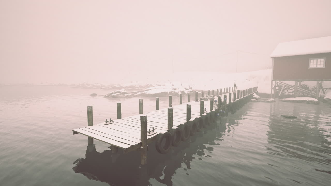 Foggy winter morning on a secluded dock with snow covered surroundings