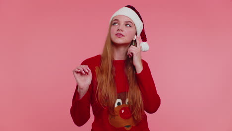 Woman-in-Christmas-sweater-listening-music-via-earphones,-dancing-disco-fooling-around-having-fun