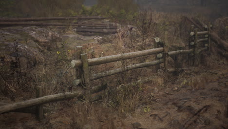 An-old-wood-fence-with-a-country-field-behind-it