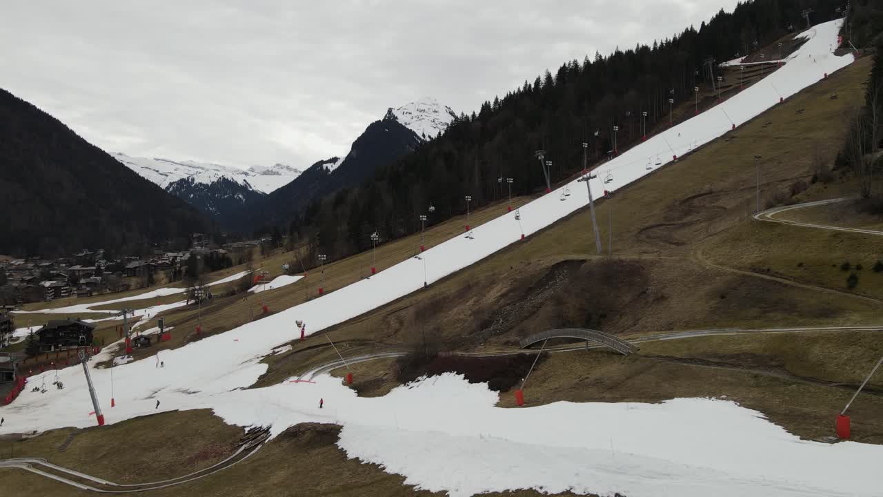 Empty and melted ski slopes in Morzine, French alps during record warm month of March