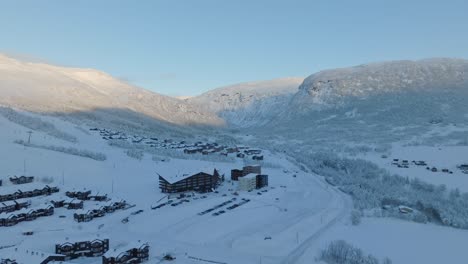 myrkdalen valley leading to mountain vikafjell - winter aerial above road rv13 with myrkdalen hotel and skiing resort to the left