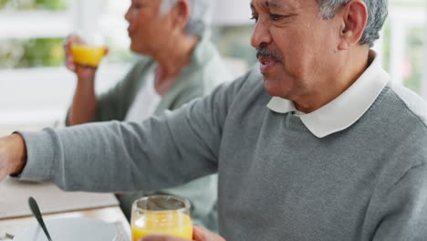Senior-couple,-man-and-juice-at-breakfast