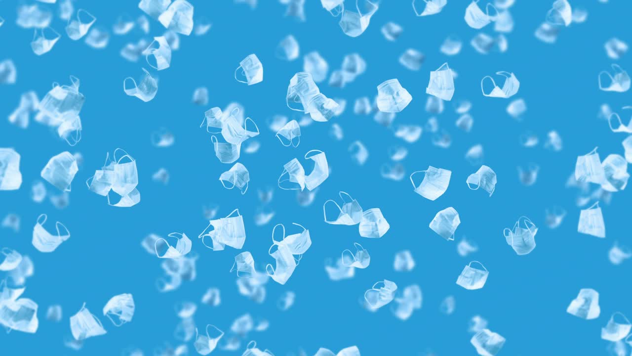 파란색 바탕에 많은 색 마스크를 날리는 의료 개념, 수술 보호 마스크, 마스크 회전의 3d 애니메이션, 루프 애니메이션.