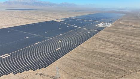 aerial view of power station with solar photovoltaic panels in middle of desert in china