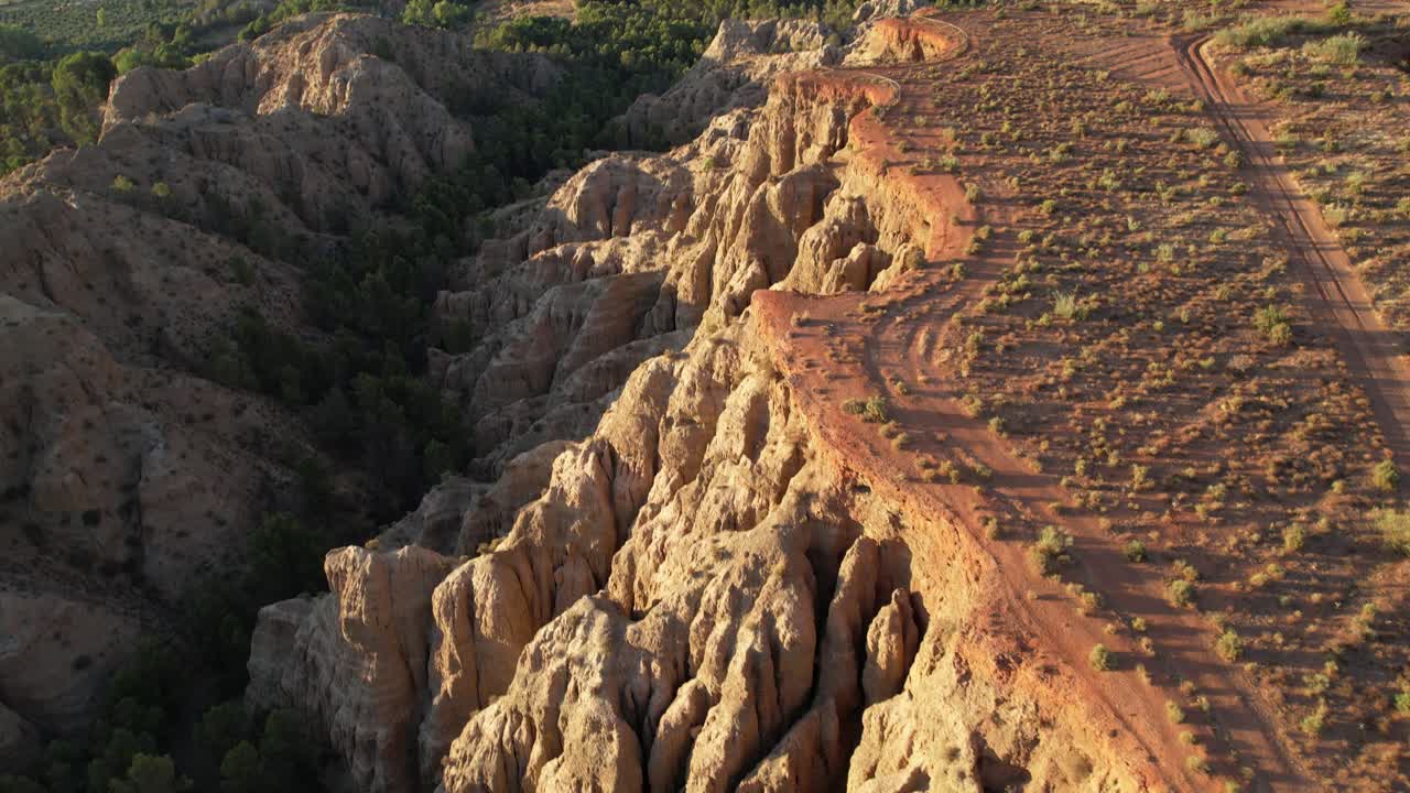 Geology. erosion effect. Ravine and gullies at sunset, aerial view. Badlands caused by severe erosion. Climate change and desertification. Viewpoint of the end of the world. Purullena. Granada. Spain