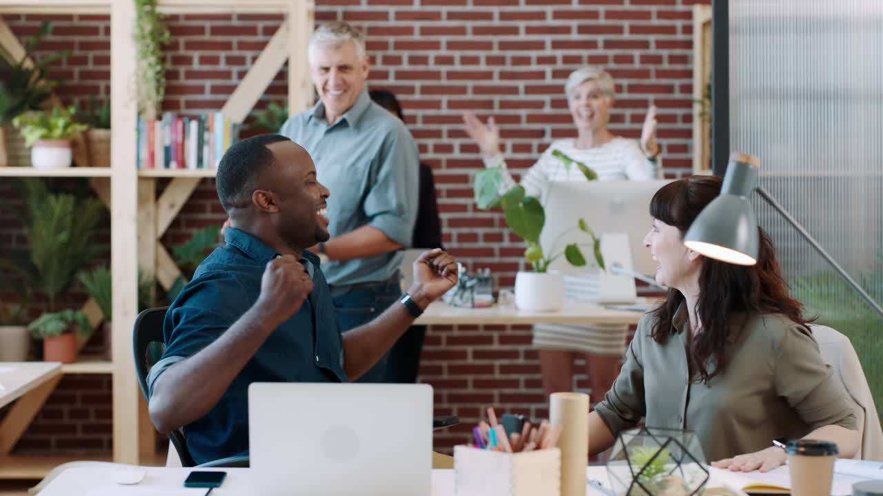Black man, startup office and celebrate