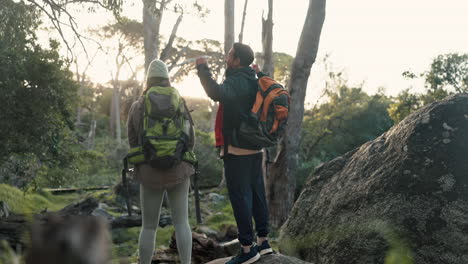 Hiking,-couple-and-celebration-from-back-in-woods