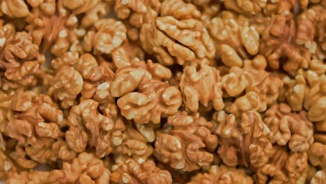 looped spinning walnuts without the shell close-up full frame background