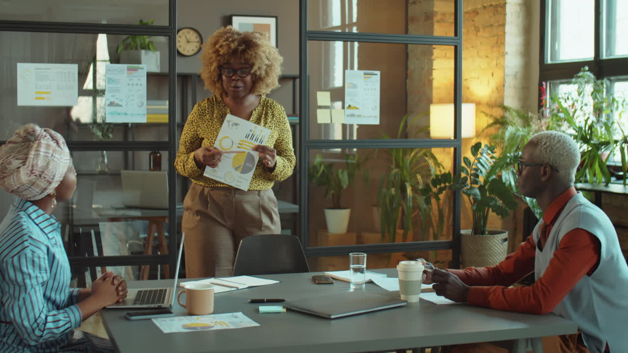 Black Businesswoman Giving Presentation at Office Meeting