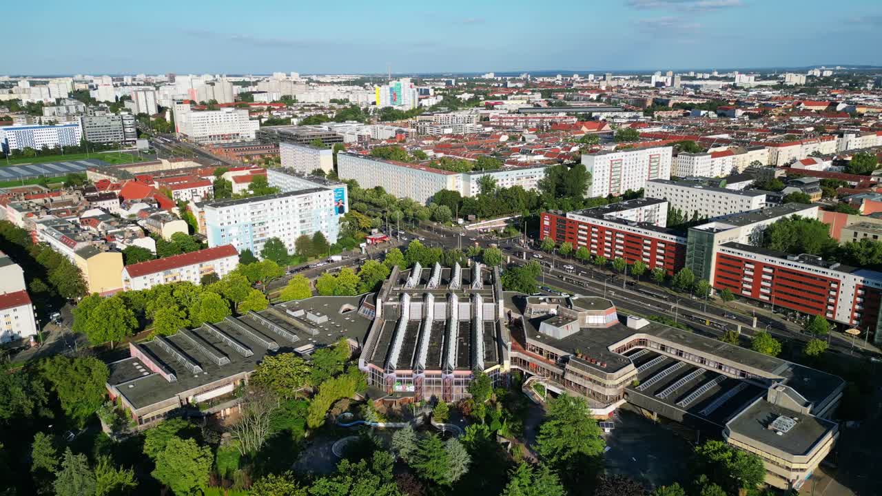 Sez and Volkspark Friedrichshain in Berlin, showcasing its lush greenery, a passing tram on a sunny day. speed ramp hyper motion time lapse Nice aerial view flight panorama orbit drone