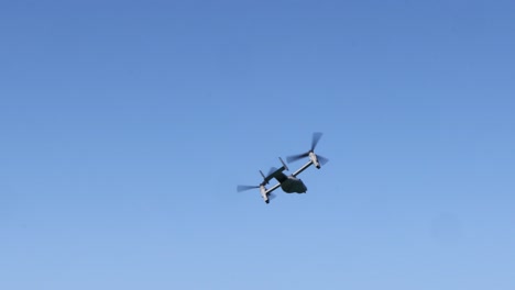 a sequence of a helicopter flying against a blue sky