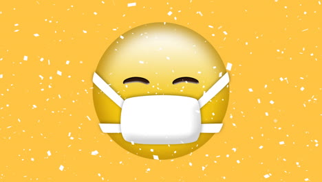 animation of white confetti falling over emoji in face mask on yellow background