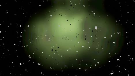 animation of black and white confetti over green background