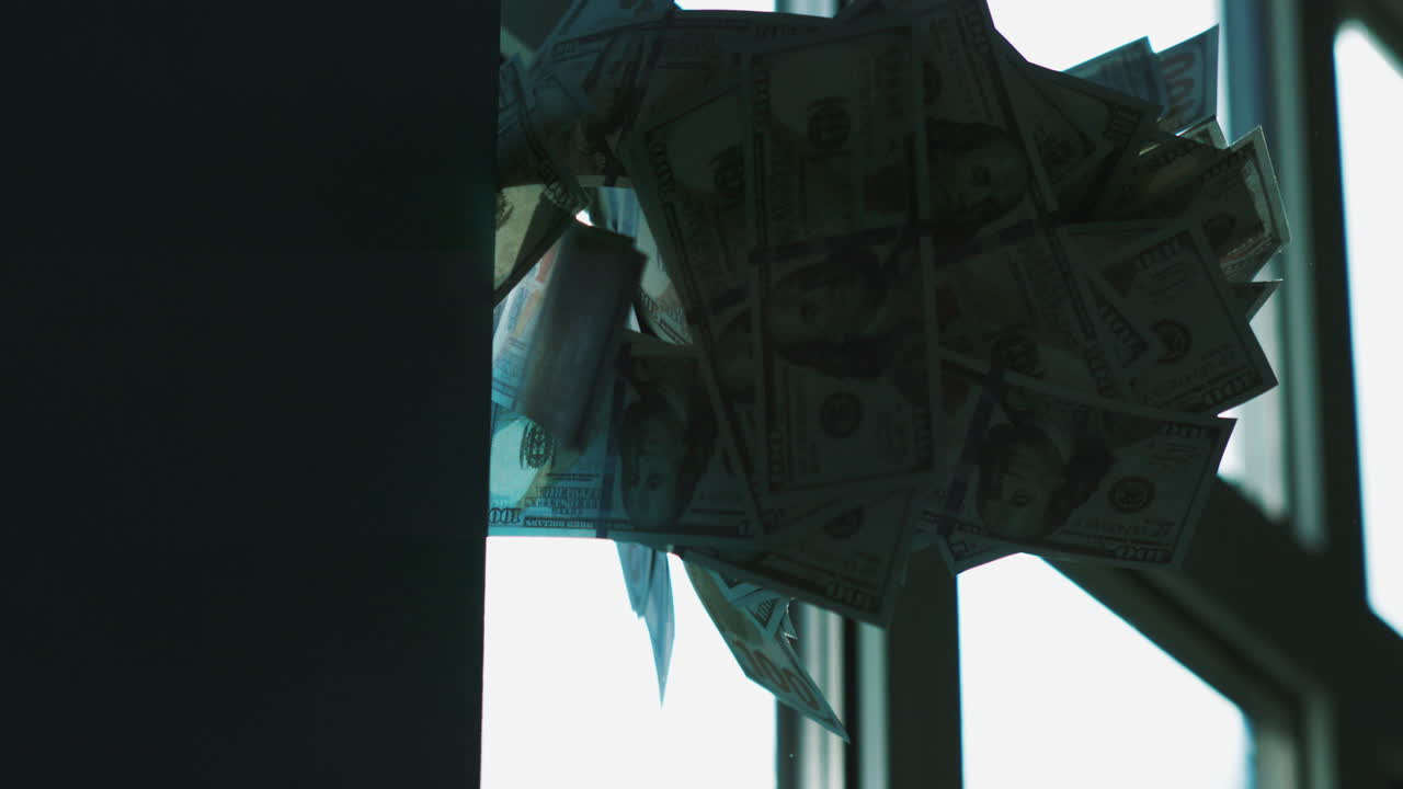 한 달러의 지폐가 창문에 매달려 있습니다.