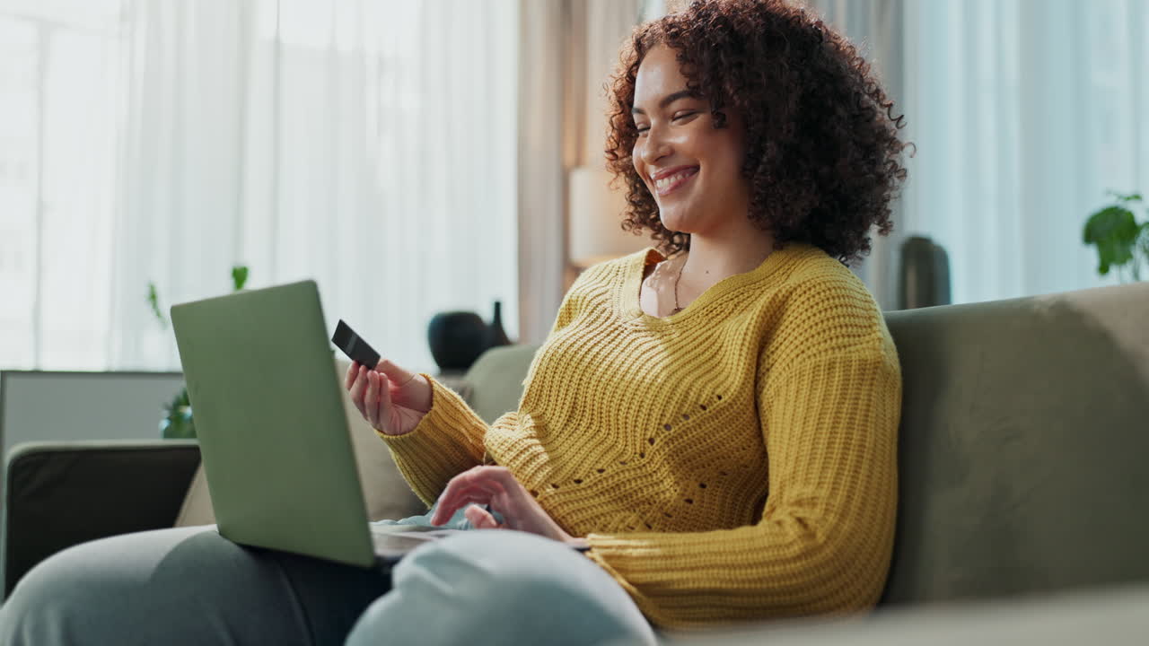 Woman shopping online with laptop and credit card