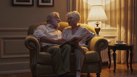 senior couple reading newspaper at home