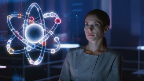 a woman interacting with a digital atom hologram