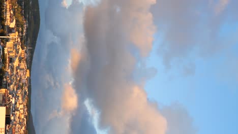 cityscape with dramatic clouds at sunrise/sunset