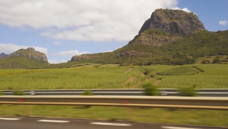 a shot from a car of mauritiusâ´mountains while driving