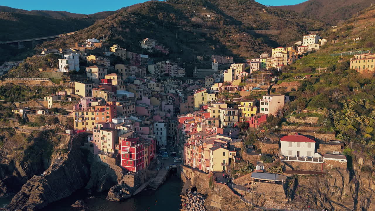 Colorful houses in Riomaggiore, Cinque Terre, clinging to cliffs by the sea