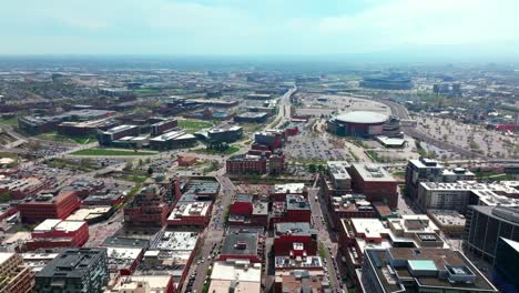 downtown denver spring summer after rain thunderstorm aerial drone colorado cityscape landscape buildings ball arena sunny blue skies cloudy afternoon i25 cars traffic university circle left motion