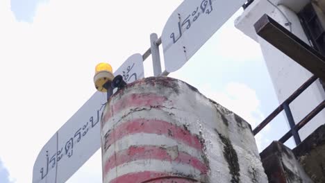 pov shot of boat sign along chao phraya river in the day in bangkok, thailand