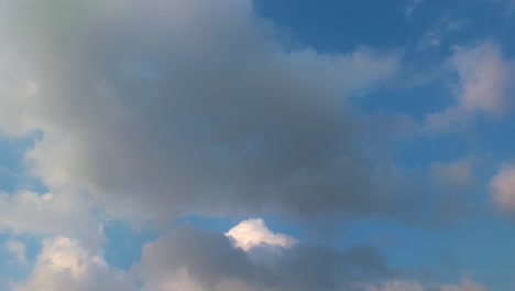 timelapse of white clouds on blue sky background