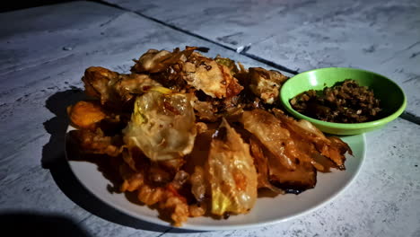 the delicious sweet dessert, pisang goreng or indonesian fried bananas, served with sauce