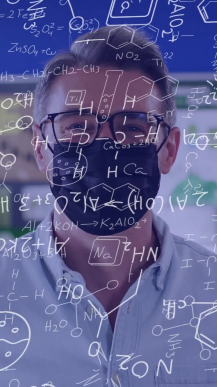 Animation of mathematical equations over caucasian male teacher with face mask in classroom