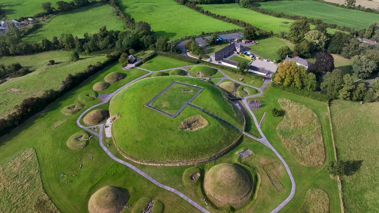 Beautiful drone view of Neolithic monument Knowth in Ireland. Green mounds and tombs