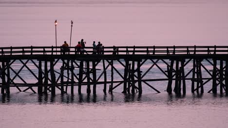 the mon bridge is an old wooden bridge located in sangkla, thailand