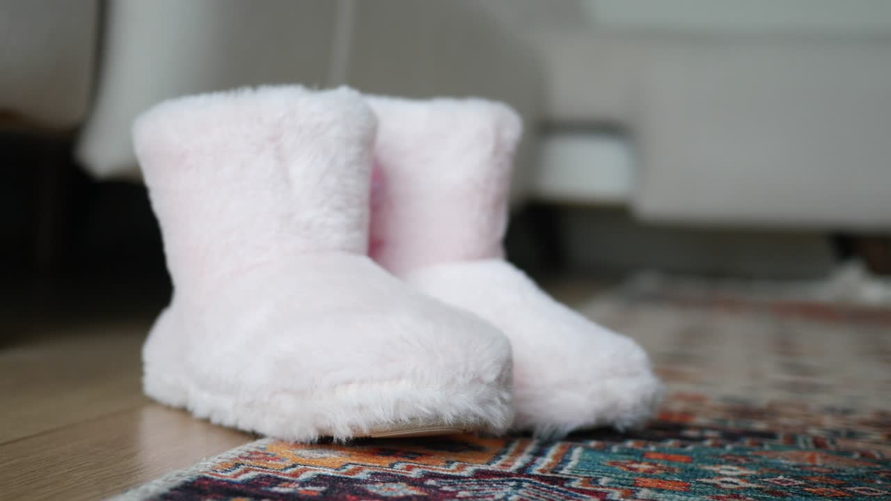 Fluffy Pink Slippers on a Rug