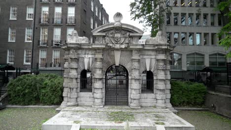 historic stone archway in a london garden