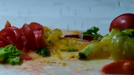 close-up water spray on freshly chopped vegetables for salad: slow motion