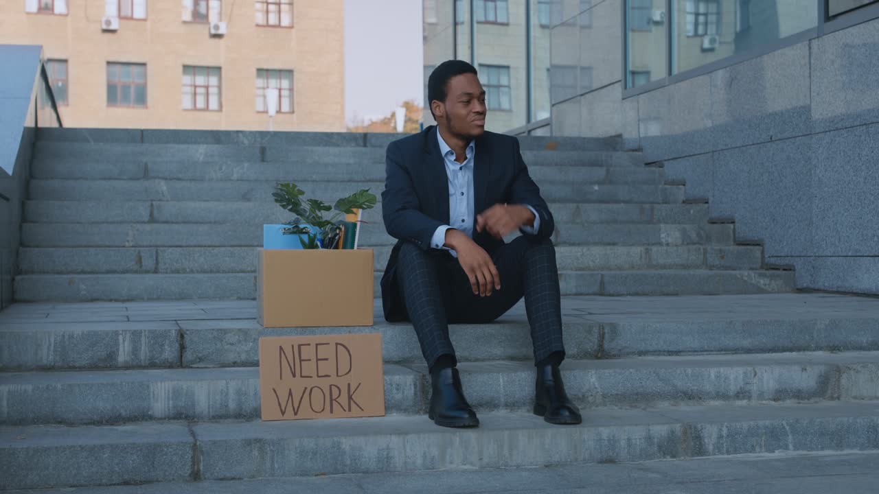 Unemployed Businessman Sitting on Steps