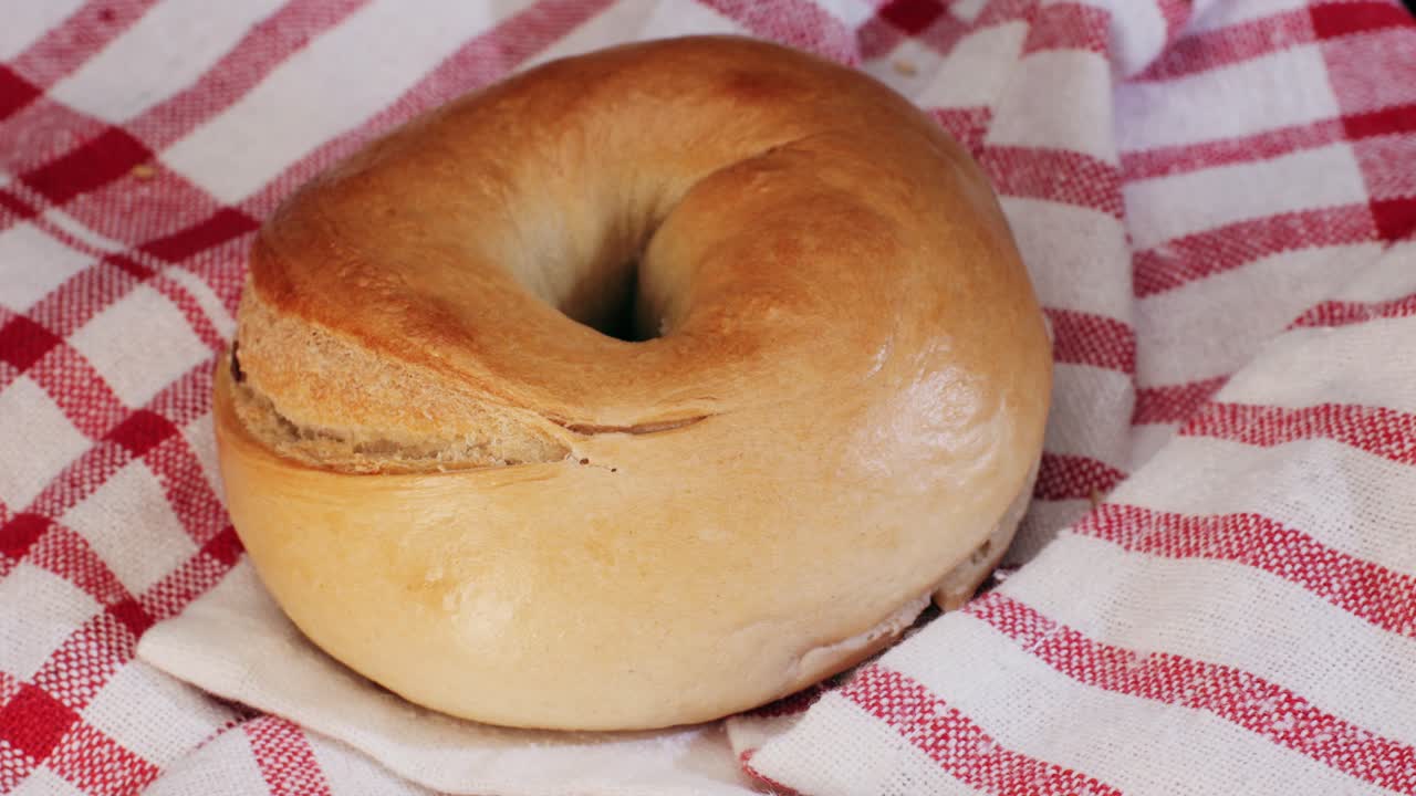 Bagel sandwich brunch, lunch plate of a bagel with smoked salmon and cream cheese and ham, close up morning cafe menu.