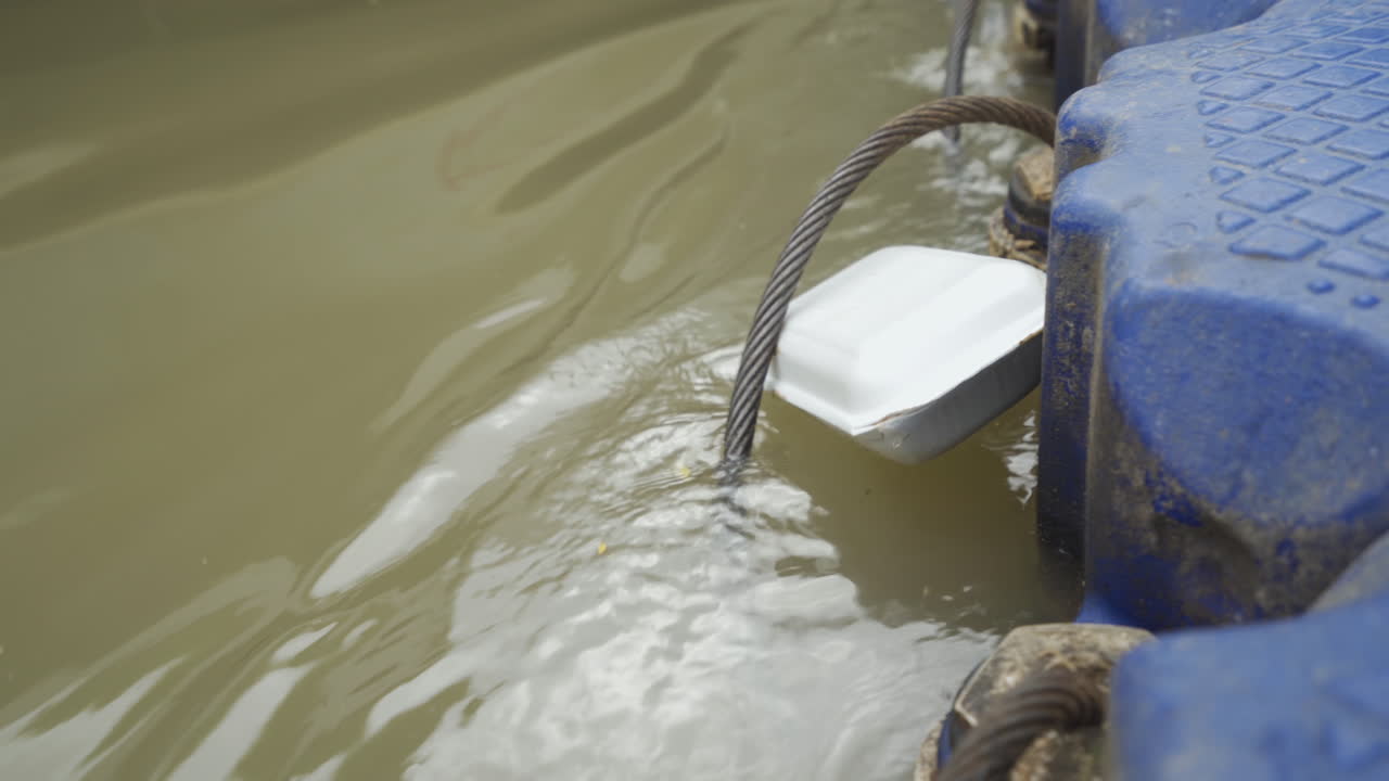 Dock with foam box attached to cable.