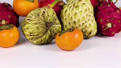 assorted tropical fruits arranged on a table