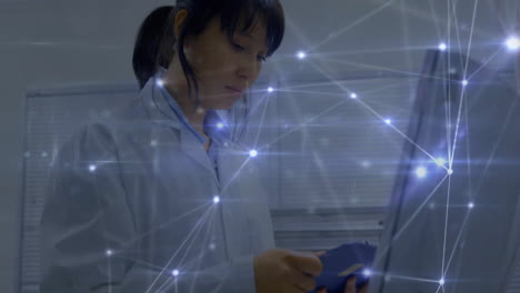 scientist working in lab with network connections animation over her