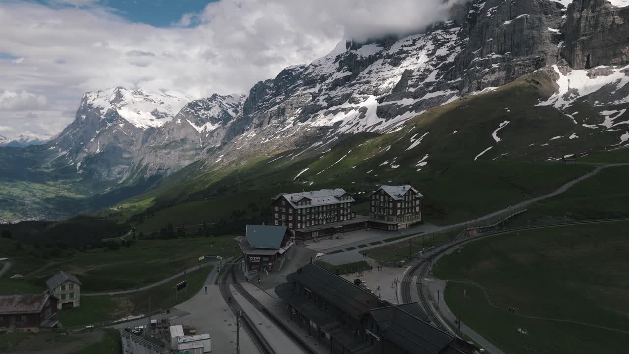 Zoomed Out Circling Shot of Kleine Scheidegg and Alps
